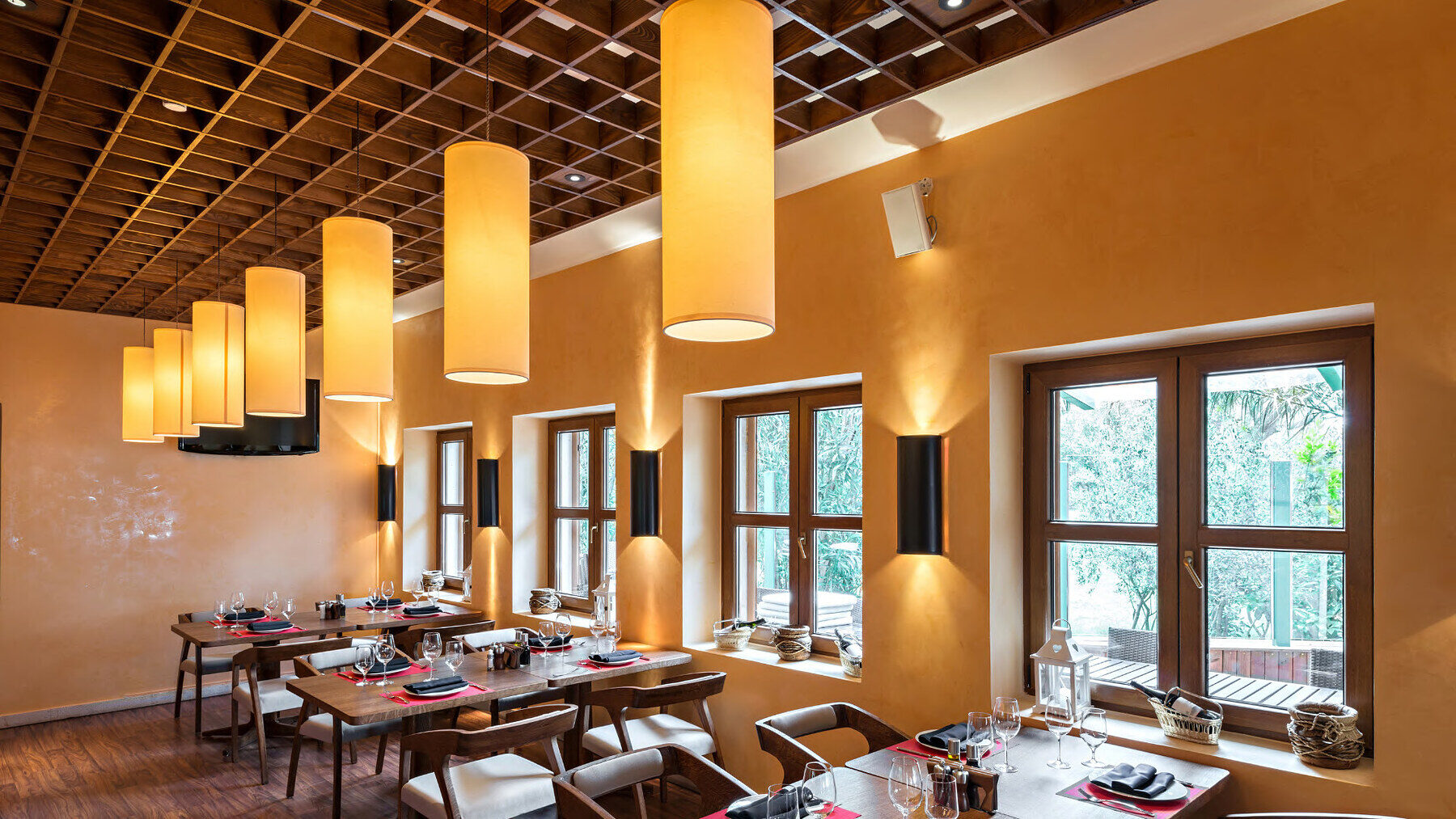 A warm restaurant interior with feature lighting