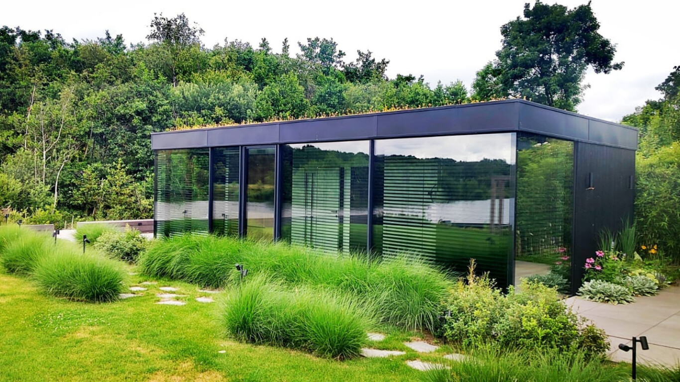 Glass pavilion by the water