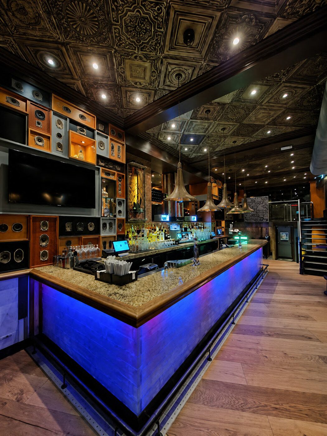 The bar at Hard Rock Cafe Amsterdam with memorabilia on the walls